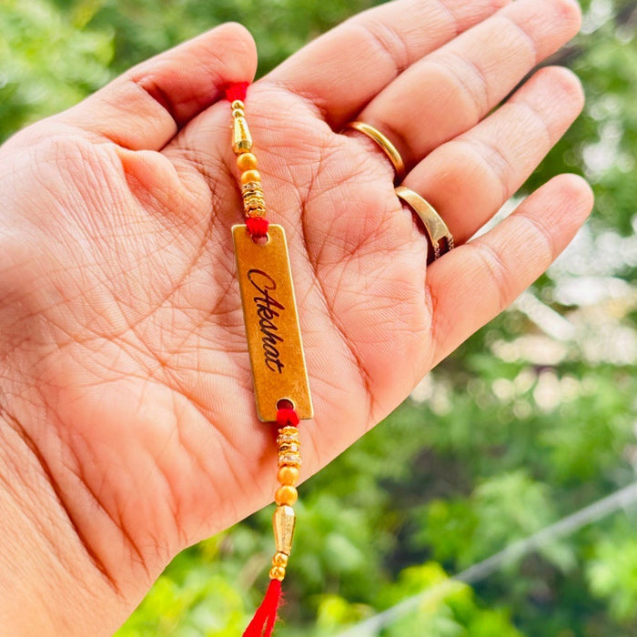 Name Rakhi Golden Plate Red